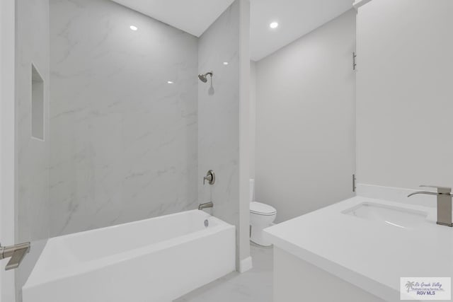 7336 San Andres St, Brownsville, TX 78526 - full bathroom featuring marble look tile flooring, toilet, washtub / shower combination, vanity, and recessed lighting
