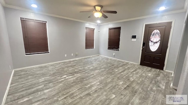 2839 Regency Dr, Brownsville, TX 78526 - foyer entrance with wood finished floors, ceiling fan, baseboards, and ornamental molding