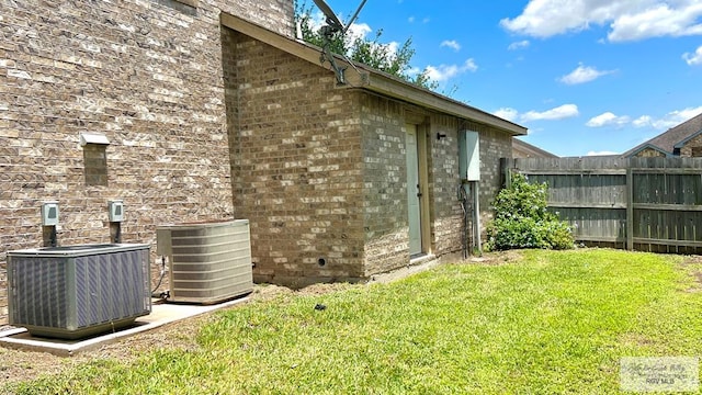 2839 Regency Dr, Brownsville, TX 78526 - view of property exterior featuring central AC and brick siding