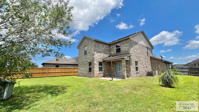 2839 Regency Dr, Brownsville, TX 78526 - back of house with brick siding and central air condition unit