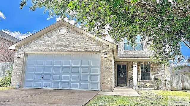 2839 Regency Dr, Brownsville, TX 78526 - view of front of house with concrete driveway, fence, a garage, and brick siding