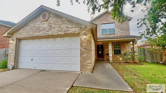 2839 Regency Dr, Brownsville, TX 78526 - traditional-style home featuring concrete driveway, an attached garage, stone siding, and brick siding