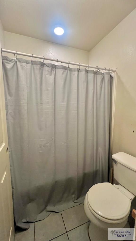 2839 Regency Dr, Brownsville, TX 78526 - full bathroom featuring tile patterned flooring and toilet