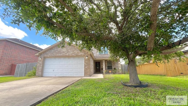 2839 Regency Dr, Brownsville, TX 78526 - view of front of home with brick siding, a garage, and concrete driveway