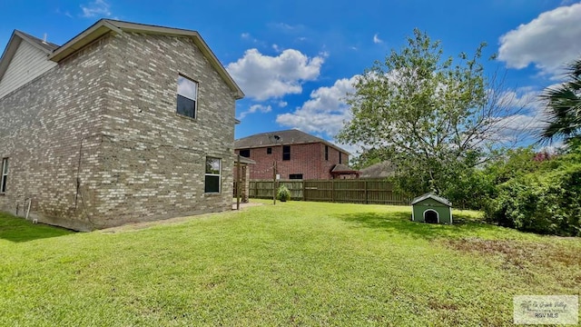 2839 Regency Dr, Brownsville, TX 78526 - view of yard featuring a storage unit and an outdoor structure