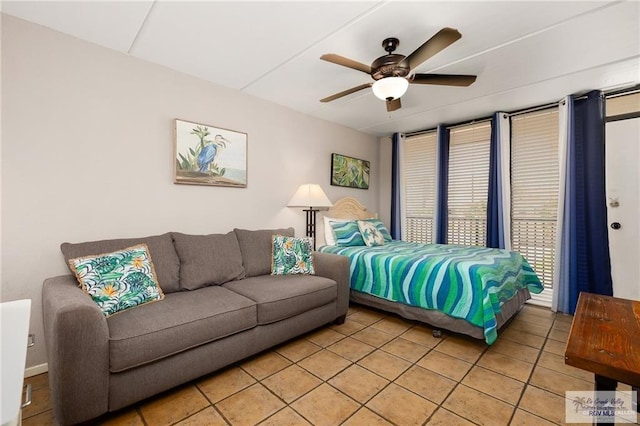 110 E Pompano St, South Padre Island, TX 78587 - bedroom featuring light tile patterned flooring and ceiling fan