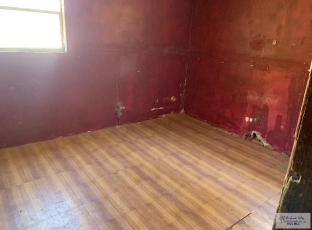 453 Sombra St, San Benito, TX 78586 - spare room with wood finished floors