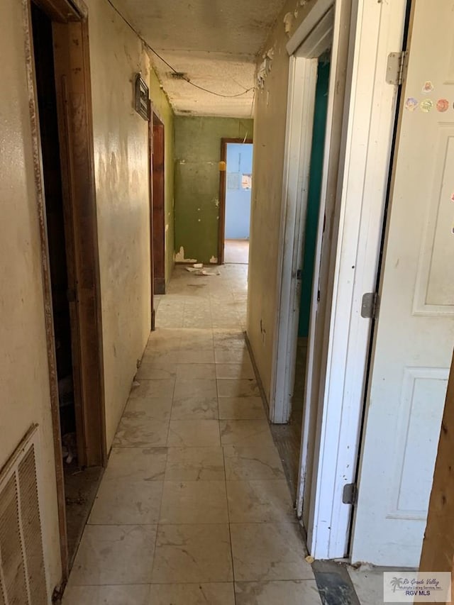 453 Sombra St, San Benito, TX 78586 - hallway featuring visible vents