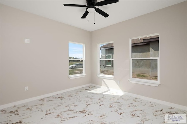 spare room with ceiling fan