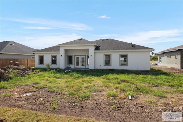 back of property featuring french doors