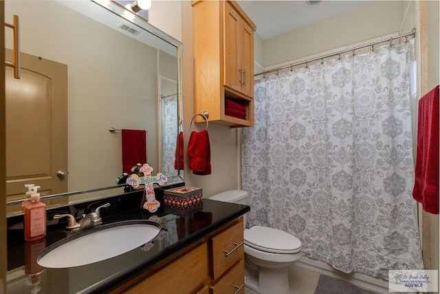 bathroom featuring a shower with curtain, tile patterned flooring, vanity, and toilet