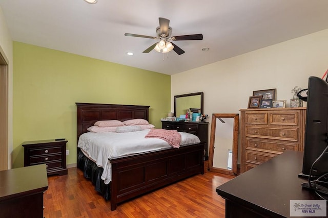 bedroom featuring ceiling fan and hardwood / wood-style floors