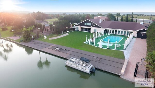 birds eye view of property with a water view