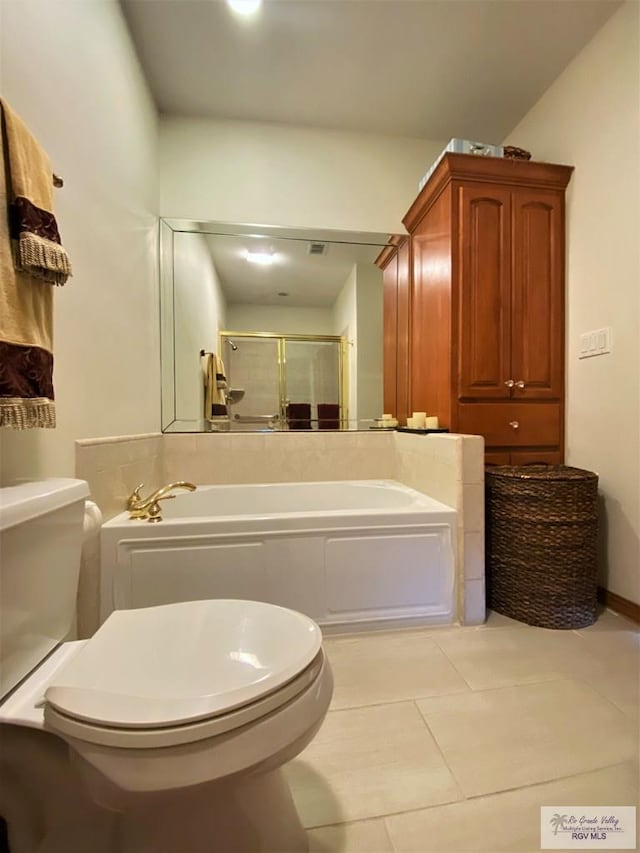 bathroom featuring tile patterned flooring, plus walk in shower, and toilet