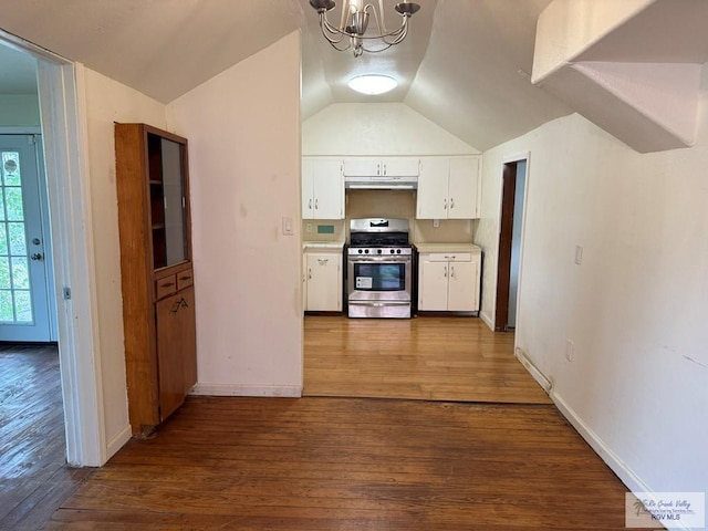 54 Shary Ave, Brownsville, TX 78521 - kitchen featuring gas stove, a chandelier, white cabinetry, vaulted ceiling, and dark wood-type flooring