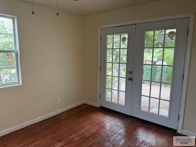 54 Shary Ave, Brownsville, TX 78521 - doorway to outside featuring french doors and dark wood-style floors