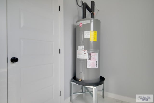 utility room with electric water heater