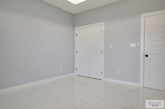 unfurnished bedroom featuring a closet