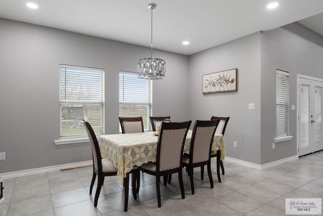 dining area with a chandelier, light tile patterned floors, recessed lighting, and baseboards