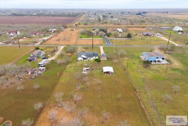 birds eye view of property featuring a rural view