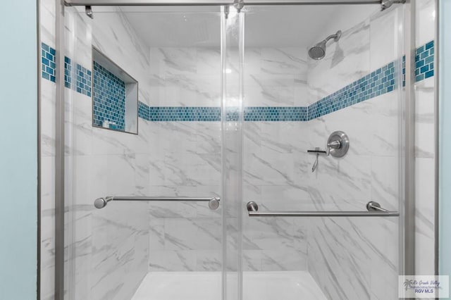 111 E Morningside Dr Unit 209, South Padre Island, TX 78597 - bathroom featuring a marble finish shower