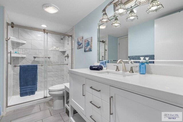 111 E Morningside Dr Unit 209, South Padre Island, TX 78597 - full bathroom featuring vanity, a shower stall, and tile patterned floors