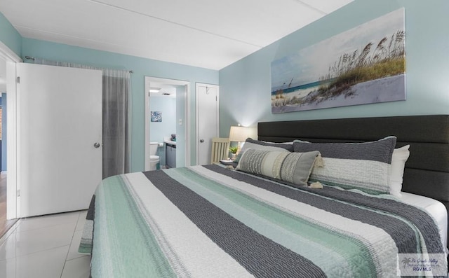 111 E Morningside Dr Unit 209, South Padre Island, TX 78597 - tiled bedroom with ensuite bathroom