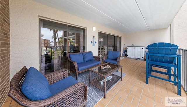 111 E Morningside Dr Unit 209, South Padre Island, TX 78597 - view of patio / terrace featuring an outdoor living space