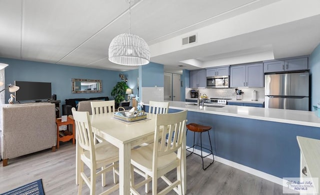 111 E Morningside Dr Unit 209, South Padre Island, TX 78597 - dining space with light wood-type flooring