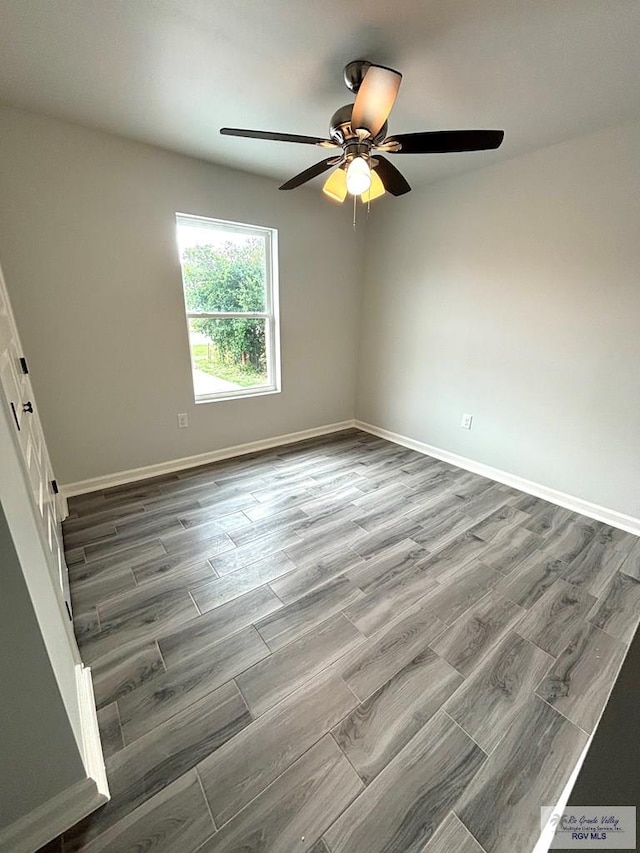 unfurnished room with hardwood / wood-style floors and ceiling fan