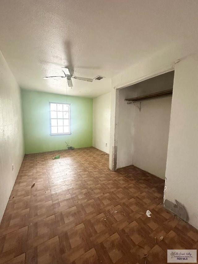 22920 Angel St, Harlingen, TX 78552 - unfurnished bedroom featuring a ceiling fan and a closet