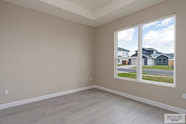 spare room featuring light hardwood / wood-style floors