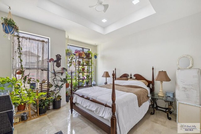 6221 Grapevine Loop, Brownsville, TX 78526 - bedroom featuring a tray ceiling