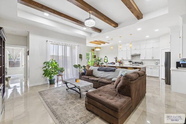 6221 Grapevine Loop, Brownsville, TX 78526 - living room featuring a chandelier, beamed ceiling, recessed lighting, and light marble finish floors