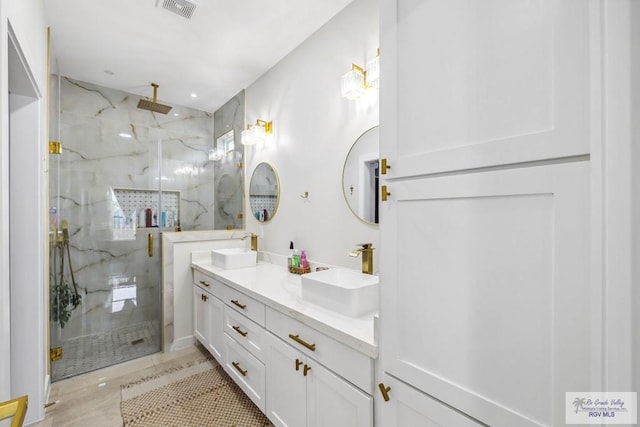 6221 Grapevine Loop, Brownsville, TX 78526 - bathroom with a marble finish shower, double vanity, and tile patterned floors