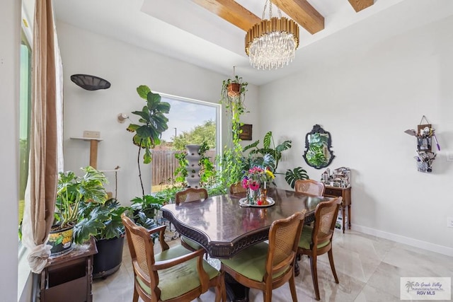 6221 Grapevine Loop, Brownsville, TX 78526 - dining area featuring a chandelier and baseboards