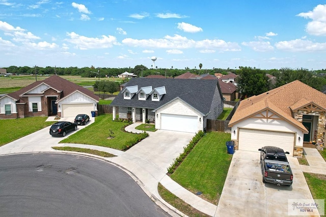 view of front of house with a front lawn and a garage