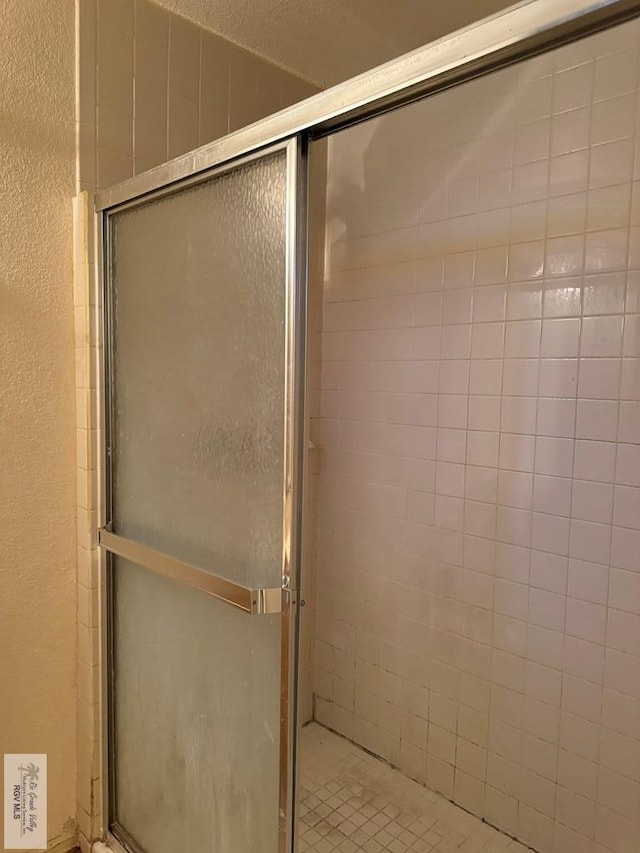 bathroom featuring an enclosed shower