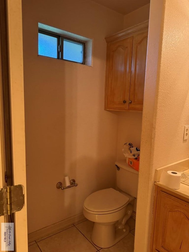 bathroom with tile patterned floors, vanity, and toilet