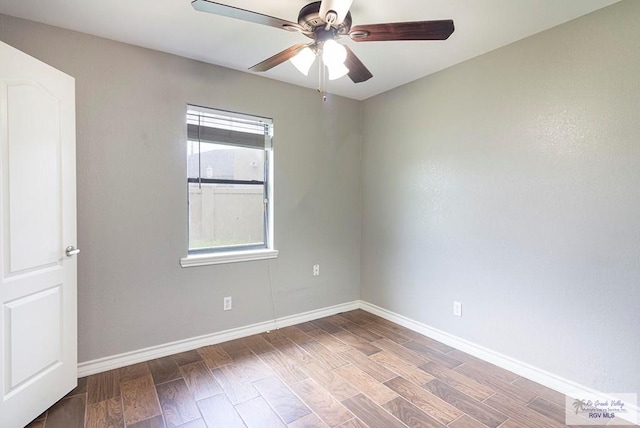 unfurnished room featuring baseboards, a ceiling fan, and wood finished floors