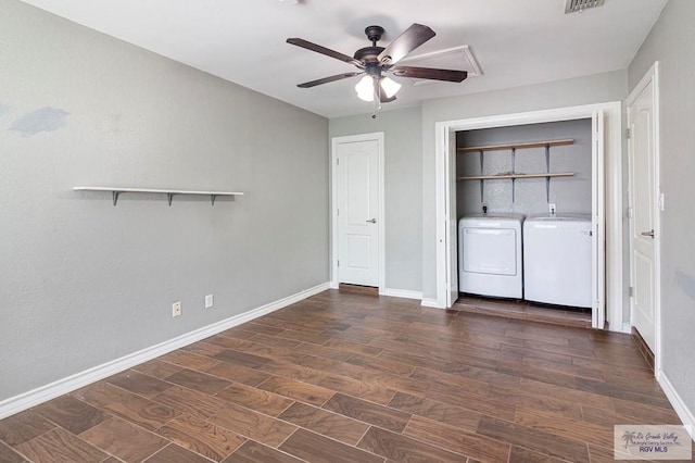 clothes washing area with a ceiling fan, baseboards, laundry area, separate washer and dryer, and dark wood-type flooring