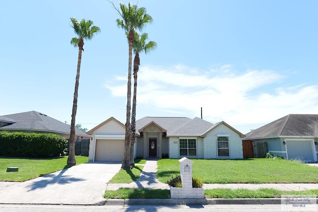 9165 Los Olmos Dr, Los Fresnos, TX 78566 - ranch-style house featuring driveway, an attached garage, and a front lawn