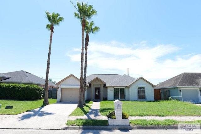 9165 Los Olmos Dr, Los Fresnos, TX 78566 - single story home with driveway, a garage, and a front lawn