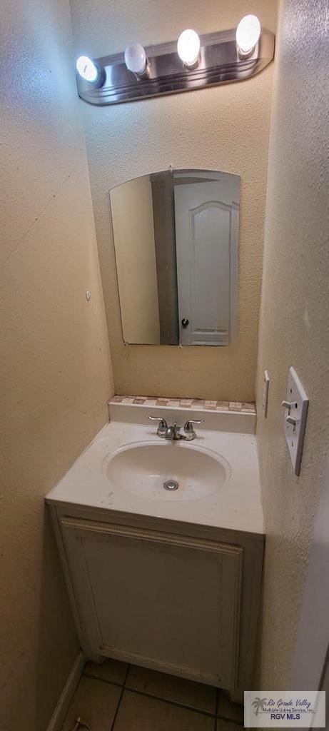 bathroom featuring tile patterned floors and vanity