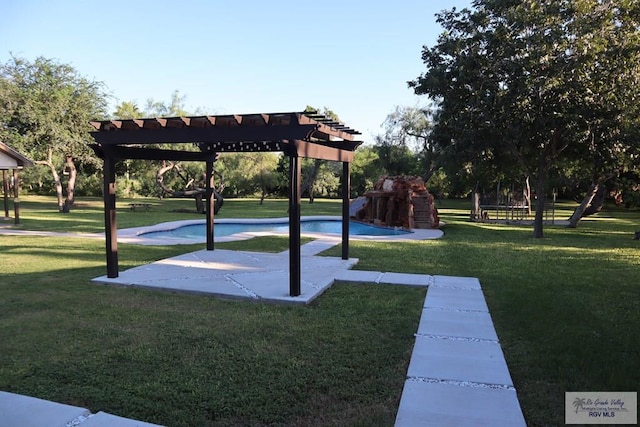 view of home's community with a pergola, a trampoline, and a lawn