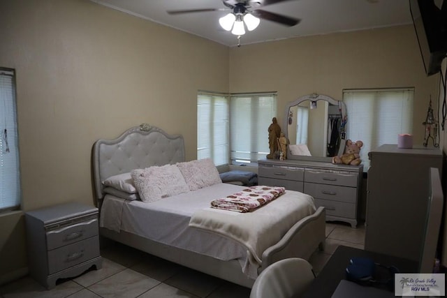 bedroom with light tile patterned floors and ceiling fan