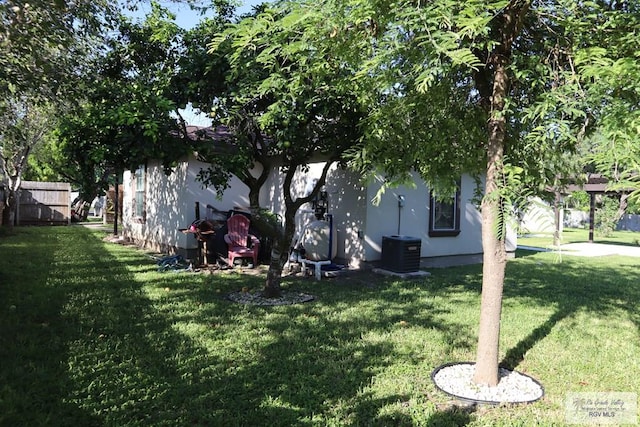 view of yard featuring central air condition unit