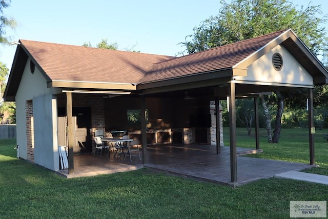 exterior space featuring a lawn and a patio area