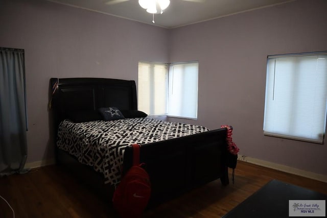 bedroom featuring hardwood / wood-style floors and ceiling fan