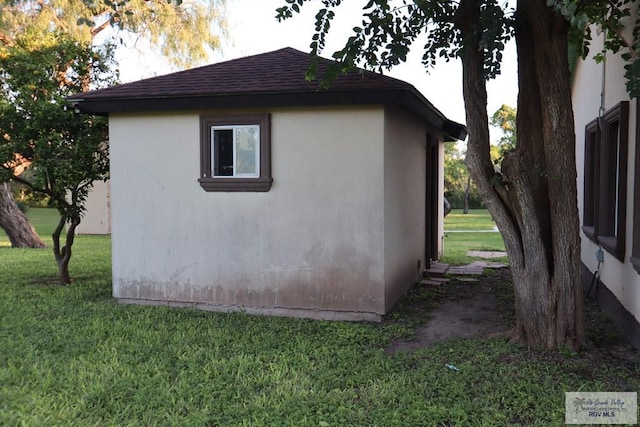 view of side of home featuring a yard